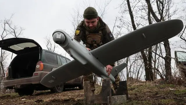 epa11155599 A Ukrainian serviceman from the 108th Brigade of Territorial Defence prepares a Ukraine-made multi-purpose drone Leleka-100 on a field near a frontline in the direction of Zaporizhzhia, Ukraine, 15 February 2024, amid the Russian invasion. Russian troops entered Ukrainian territory on 24 February 2022, starting a conflict that has provoked destruction and a humanitarian crisis. EPA/KATERYNA KLOCHKO