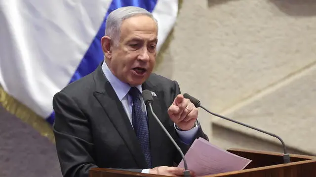 epa11166727 Israeli Prime Minister Benjamin Netanyahu speaks during the voting session for the impeachment of Hadash-Taâ€™al party MP Ofer Cassif in Jerusalem, 19 February 2024. The motion was brought up after Cassif publicly supported South Africaâ€™s genocide case against Israel at the International Court of Justice (ICJ). EPA/ABIR SULTAN