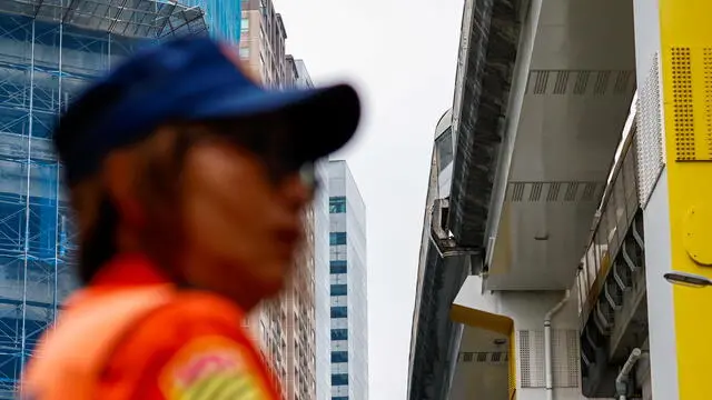 epa11256679 A police officer stands guard near a damaged overhead railway bridge following a magnitude 7.4 earthquake near Hualien, in New Taipei, Taiwan, 03 April 2024. A magnitude 7.4 earthquake struck Taiwan on the morning of 03 April with an epicenter 18 kilometers south of Hualien City at a depth of 34.8 km, according to the United States Geological Survey (USGS). EPA/DANIEL CENG