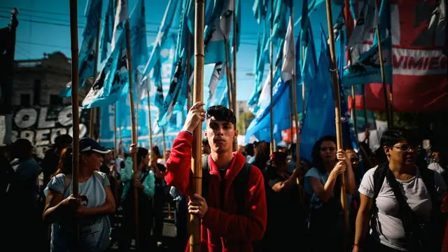 epa11228221 Members of social organizations demonstrate during a protest against the Milei government in Buenos Aires, Argentina, 18 March 2024. Social organizations take to the streets to protest against the adjustment of the Executive of Javier Milei, on a day in which he plans to carry out 500 cuts throughout the country, including the accesses to Buenos Aires from the towns of the province of the same name -the most populated in Argentina. EPA/JUAN IGNACIO RONCORONI