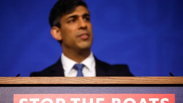 epa11293509 A slogan reading 'Stop The Boats' on the front of a lectern during a news conference by British Prime Minister Rishi Sunak on his flagship Rwanda migration policy, in London, Britain, 22 April 2024. Sunak seeks to push a bill through the Parliament that enables his flagship migration policy as the British prime minister seeks to regain momentum 10 days from a crucial set of local elections. EPA/JASON ALDEN / POOL