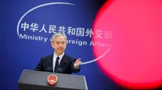 epa10948647 China's Foreign Ministry spokesperson Wang Wenbin gestures as he holds a press conference at the Ministry of Foreign Affairs in Beijing, China, 30 October 2023. EPA/WU HAO