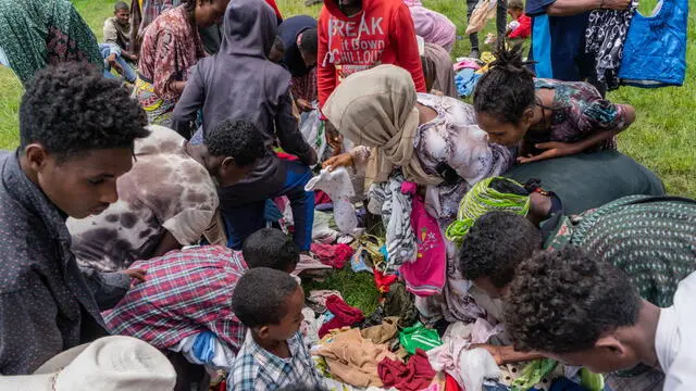 epa09421584 Ethiopian Internally Displaced Peoples (IDP's) who fled the fighting in the Tigray region collects clothes from local donors as they take shelter in a make-shift IDP camp at a school in Dessie, Ethiopia, 19 August 2021 (20 August 2021). According to Dessie government communications officer Mesaye Kider, 55,000 Ethiopians have fled from war torn Tigray region in the north and are taking shelter in makeshift camps. This occurred as the Tigray Peoples Liberation Front (TPLF) captured Alamata and Kobo area's in the war that has been going on with Ethiopia's national military. EPA/STR