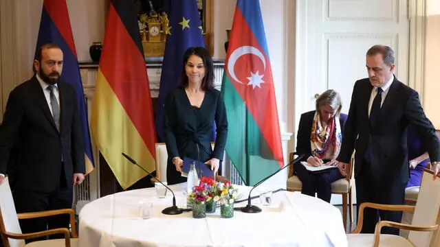 epa11186652 German Foreign Minister Annalena Baerbock (C), Armenian Minister of Foreign Affairs Ararat Mirzoyan (L) and Azerbaijan's Foreign Minister Jeyhun Bayramov (R) arrive for a press statement during a meeting on the occasion of peace talks between Armenia and Azerbaijan at the Villa Borsig venue of the Foreign Ministry in Berlin, Germany, 28 February 2024. The German foreign minister welcomed Armenia's foreign minister and Azerbaijan's foreign minister for peace negotiations in Berlin. EPA/CLEMENS BILAN