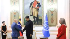 epa11294942 A handout photo made available by the Miraflores Press shows President of Venezuela Nicolas Maduro (2-R) greeting the prosecutor of the International Criminal Court (ICC) Karim Khan (2-L), who is in the country to launch a joint work plan together with the High Court and the government in Caracas, Venezuela, 22 April 2024. The meeting is the first stop for Khan, who will also meet with President of the National Assembly Jorge Rodriguez, who is the subject of an investigation since November 2021, which at the moment is stopped but not suspended, by the High Court for alleged crimes against humanity. EPA/Miraflores Press / HANDOUT EDITORIAL USE ONLY/NOT FOR SALES/ONLY AVAILABLE TO ILLUSTRATE THE ACCOMPANYING STORY/CREDIT MANDATORY HANDOUT EDITORIAL USE ONLY/NO SALES HANDOUT EDITORIAL USE ONLY/NO SALES