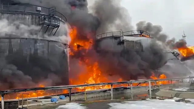 epa11089527 A still image taken from a handout video provided Â by the Russian Emergencies Ministry Press-Service shows Russian firefighters extinguishing a fire following a reported drone attack on the territory of the Klintsevskaya oil depot, near Bryansk, Bryansk region, Russia, 19 January 2024. Oil storage tanks caught fire after a Ukrainian drone attacked an oil depot in Klintsy, Russia's Bryansk region, regional governor Aleksandr Bogomaz wrote on telegram, adding that there were no casualties in the incident. Some 32 residents of the private sector were temporarily evacuated and more than 140 people were deployed to fight the fire. EPA/RUSSIAN EMERGENCIES MINISTRY HANDOUT -- BEST QUALITY AVAILABLE -- HANDOUT EDITORIAL USE ONLY/NO SALES HANDOUT EDITORIAL USE ONLY/NO SALES