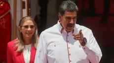 epa11298676 The president of Venezuela, Nicolas Maduro (C) prepares with the first lady Cilia Flores (L), to receive the leaders who will participate in the ALBA Summit at the Miraflores Palace, in Caracas, Venezuela, 24 April 2024. The XXIII Summit of the Bolivarian Alliance for the Peoples of Our America (ALBA) brings together in Caracas presidents of several bloc countries, among them, the Cuban Miguel Diaz-Canel, the Nicaraguan Daniel Ortega, and the Bolivian Luis Arce, who will meet with their Venezuelan counterpart Nicolas Maduro in a conclave in which they will address issues of common interest. EPA/Miguel Gutierrez