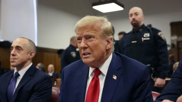 epa11300371 Former President Donald Trump sits in a Manhattan Criminal Courtroom with members of his legal team for the continuation of his hush money trial in New York, USA, 25 April 2024. Trump is facing 34 felony counts of falsifying business records related to payments made to adult film star Stormy Daniels during his 2016 presidential campaign. EPA/Spencer Platt / POOL