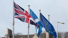 epa08185223 (L-R) British, Scottish and EU flags are seen during a demonstration of Stand Up For Scotland outside the Scottish Parliament at Holyrood, Edinburgh, Scotland, Britain, 01 February 2020, a day after Britain has officially left the EU. EPA/ROBERT PERRY