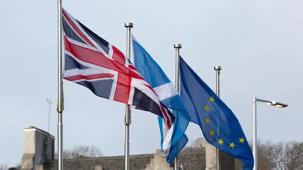 epa08185223 (L-R) British, Scottish and EU flags are seen during a demonstration of Stand Up For Scotland outside the Scottish Parliament at Holyrood, Edinburgh, Scotland, Britain, 01 February 2020, a day after Britain has officially left the EU. EPA/ROBERT PERRY