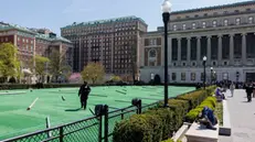 epa11303832 A lawn cleared for an upcoming graduation ceremony is guarded by security on Columbia University's campus in New York, New York, USA, 26 April 2024. Students have been protesting the university's investments in Israel and showing their support for Palestine for almost two weeks, also inspiring other students nationwide to do the same. EPA/SARAH YENESEL