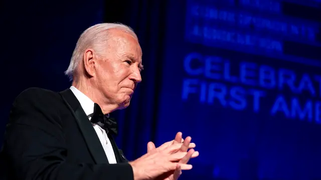 epa11306187 President Joe Biden looks on during the White House Correspondentsâ€™ Association dinner at the Washington Hilton in Washington, DC, USA, 27 April 2024. EPA/BONNIE CASH / POOL