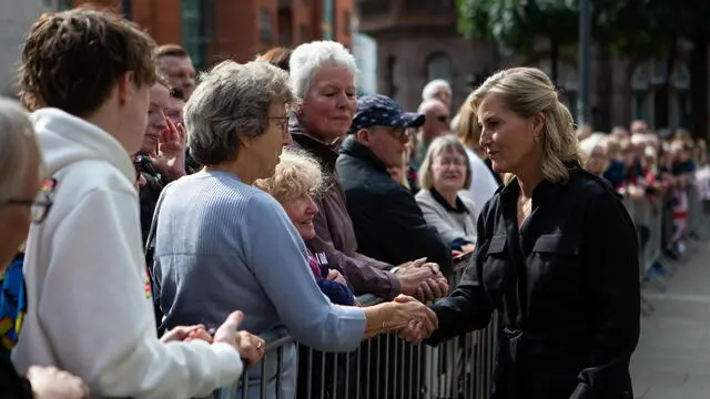 epa10185447 Sophie (R), Countess of Wessex, meets the public as she arrives at the Manchester Central Library to view the civic Book of Condolence for late Queen Elizabeth II, in Manchester, Britain, 15 September 2022. The Earl and Countess of Wessex visited Manchester to view floral tributes left by the public in St Ann's Square and to light a memorial candle at Manchester Cathedral following the death of Queen Elizabeth II on 08 September 2022. The late Queen's lying in state in London's Westminster Hall will last for four days and will end in the morning of the state funeral on 19 September. EPA/Adam Vaughan