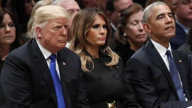 epa07210708 US President Donald J. Trump, first lady Melania Trump and former US President Barack Obama listen as former Canadian Prime Minister Brian Mulroney speaks during a State Funeral at the National Cathedral, in Washington, DC, USA, 05 December 2018. George H.W. Bush, the 41st President of the United States (1989-1993), died in his Houston, Texas, USA, home surrounded by family and friends on 30 November 2018. The body will return to Houston for another funeral service before being transported by train to the George Bush Presidential Library and Museum for internment. EPA/ALEX BRANDON / POOL