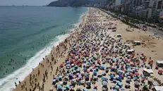 epa10409445 An aerial picture taken with a drone shows thousands of people as they enjoy the Ipanema beach in Rio de Janeiro, Brazil, 16 January 2023. The beaches in Rio have a forecast of abundant sun and heat on 16 January, with an expected maximum of 37 degree celcius and a thermal sensation of 46 degree celcius. On 15 January, the city had a maximum of 40.3 degree celcius in the early afternoon. EPA/Antonio Lacerda