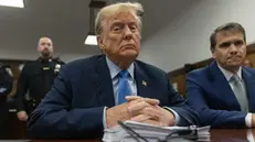 epa11303197 Former US President Donald Trump (L) sits in the courtroom during his hush money trial at Manhattan criminal court in New York, USA, 26 April 2024. Trump faces 34 felony counts of falsifying business records as part of an alleged scheme to silence claims of extramarital sexual encounters during his 2016 presidential campaign. EPA/JEENAH MOON / POOL