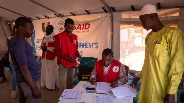 epa11275412 Workers of the World Food Programme (WFP) and Red Cross attend to refugees that have just arrived to Chad from Darfur, in a refugee camp in Adre, Chad, on the border with Sudan, 12 April 2024. Most of the refugees are women and children fleeing the hunger crisis because of the war which started on 15 April 2023. According to the UNHCR in March 2024, in one year more than 500,00 Sudanese refugees, mainly from Darfur region, have crossed into Chad looking for safety, 90 percent of them are women and children. As different humanitarian crises are unfolding in other parts of the world, both the UN and NGOs like Doctors Without Borders/MÃ©decins Sans FrontiÃ¨res (MSF) keep appealing for more aid to reach Sudan and avoid a looming famine situation in the already strained socio-economic context of Chad. EPA/STRINGER