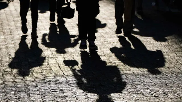 epa11294903 The shadows of people walking down a street are relected in San Jose, Costa Rica, 16 April 2024 (Issued on 22 April 2024). High temperatures and the deficit of rainfall caused by the impact of the El Nino phenomenon mark this year's Earth Day in Costa Rica, according to data from the National Meteorological Institute (NMI). During the month of April temperatures of up to 40 degrees Celsius have been registered in the area. EPA/Jeffrey Arguedas