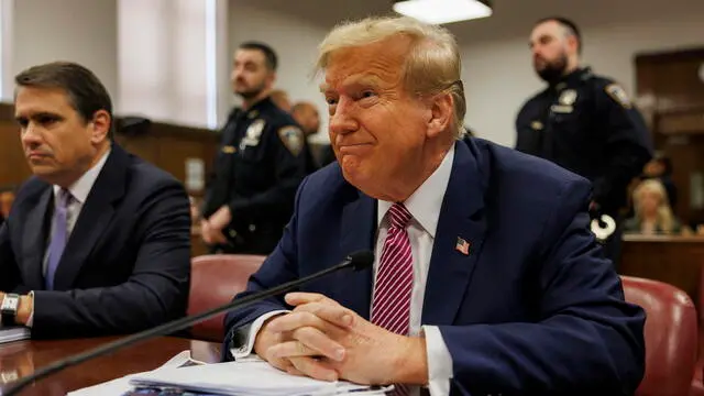 epa11288564 Former US President and current Republican presidential candidate Donald Trump (R) sits at the defendant's table at Manhattan Criminal Court in New York, New York, USA, 19 April 2024. Trump is facing 34 felony counts of falsifying business records related to payments made to adult film star Stormy Daniels during his 2016 presidential campaign. EPA/SARAH YENESEL / POOL