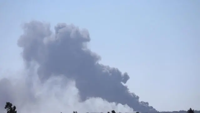 epa11324556 Smoke rises from Rafah in the southern Gaza Strip as seen from an undisclosed location in Israel, 07 May 2024. The Israel Defence Forces (IDF) said on 07 May that its ground troops began an operation targeting Hamas militants and infrastructure within specific areas of eastern Rafah, taking operational control of the Gazan side of the Rafah crossing based on intelligence information. More than 34,600 Palestinians and over 1,455 Israelis have been killed, according to the Palestinian Health Ministry and the IDF, since Hamas militants launched an attack against Israel from the Gaza Strip on 07 October 2023, and the Israeli operations in Gaza and the West Bank which followed it. EPA/ATEF SAFADI