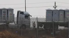 epa11300543 Humanitarian trucks carrying provisions waiting in line on the Egyptian side of the border near Kerem Shalom crossing at the southern Israeli border with the Gaza Strip, on 25 April 2024. Since 07 October 2023, up to 1.9 million people, or more than 85 percent of the population, have been displaced throughout the Gaza Strip, some more than once, according to the United Nations Relief and Works Agency for Palestine Refugees in the Near East (UNRWA), which added that most civilians in Gaza are in 'desperate need of humanitarian assistance and protection'. EPA/ATEF SAFADI