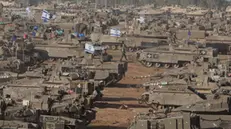 epa11329409 Israeli military vehicles gathered near the border fence with the Gaza Strip, at an undisclosed location in southern Israel, 09 May 2024. On 07 May, Israel said that its troops began an operation targeting Hamas militants and infrastructure within specific areas of eastern Rafah, taking operational control of the Gazan side of the Rafah crossing. The United States on 08 May confirmed the decision to pause a shipment of 'high payload munitions' to Israel. More than 34,900 Palestinians and over 1,455 Israelis have been killed, according to the Palestinian Health Ministry and the Israel Defense Forces (IDF), since Hamas militants launched an attack against Israel from the Gaza Strip on 07 October 2023, and the Israeli operations in Gaza and the West Bank which followed it. EPA/ABIR SULTAN