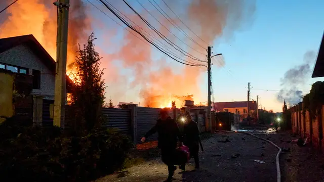 epa11330777 Ukrainian rescuers work to extinguish a fire at the site of an overnight missile strike on private buildings in Kharkiv, northeastern Ukraine, 10 May 2024, amid the Russian invasion. Kharkiv was hit by an S-300 missile at night, Mayor Ihor Terekhov wrote on telegram. At least two people, a 11-year-old child and a 72-year-old woman, were injured in the attack, according to the head of the Kharkiv Regional Military Administration, Oleg Synegubov. Russian troops entered Ukrainian territory on 24 February 2022, starting a conflict that has provoked destruction and a humanitarian crisis. EPA/SERGEY KOZLOV