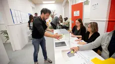 epa11334507 An official places a ballot box before the opening of a voting station in Barcelona, Spain, 12 May 2024. Catalonia holds regional elections on 12 May in which Catalans are called to elect the 15th Parliament of the autonomous community of Catalonia. EPA/Marta Perez