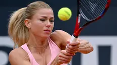 Camila Giorgi of Italy in action during her women's singles third round match against Karolina Muchova of Czech Republic (not pictured) at the Italian Open tennis tournament in Rome, Italy, 14 May 2023. ANSA/ETTORE FERRARI