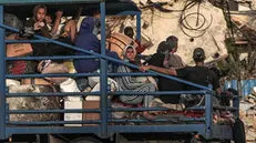 epa11332413 Internally displaced Palestinians leave with their belongings following an evacuation order issued by the Israeli army, in Rafah, southern Gaza Strip, 10 May 2024.(Issued 11 May 2024) More than 34,900 Palestinians and over 1,455 Israelis have been killed, according to the Palestinian Health Ministry and the IDF, since Hamas militant. launched an attack against Israel from the Gaza Strip on 07 October 2023, and the Israeli operations in Gaza and the West Bank which followed it. EPA/MOHAMMED SABER