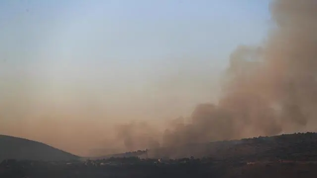 epa07811175 Smoke rises as a result of the shelling, near the Israeli village of Avivim, 01 September 2019. According to reports, tension between Israel and Lebanese militant group Hezbollah continues to escalate since last week following strikes on targets in Syria and Israeli drones fell over southern suburb of Beirut. Hezbollah fired anti-tank missile fire towards an Israeli army base next to the village of Avivim on the Israeli-Lebanese border with no injured , in responded Israeli army launching approximately 100 artillery shells at the sources of the fire. EPA/ATEF SAFADI