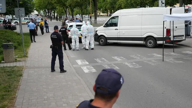 epa11342736 Scientific police investigators work near the cordoned-off crime scene where Slovak Prime Minister Robert Fico was shot earlier in the day, in Handlova, Slovakia, 15 May 2024. According to a statement from the Slovak government office on 15 May, "following a government meeting in Handlova, there was an assassination attempt on the Prime Minister of the Slovak Republic Robert Fico. He is currently being transported by helicopter to Banska Bystrica Hospital in a life-threatening condition." EPA/JAKUB GAVLAK