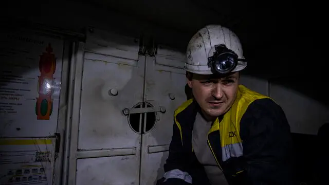 epa11266002 An Ukrainian miner prepares to go down in one of the shafts of a coal mine in Pavlohrad, Ukraine, 08 april 2024. According to mine operators, among the more than 4.000 workers, there are 600 women and more than a hundred work in technical positions underground after the Ukrainian government changed the law in 2023 when many men left the mines to join the army and positions in the mine became vacant. EPA/Maria Senovilla