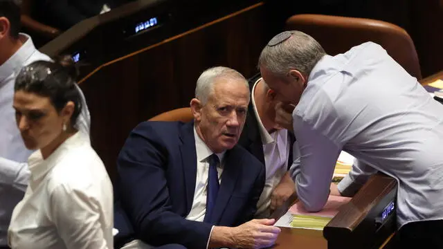 epa10766183 Leader of the State Camp party Benny Gantz (C) attends a Knesset session to vote on law on justice system reform, Israel, 24 July 2023. Mass protests continue across the country as the Israeli parliament, or Knesset, is set to hold a final vote on the bill that would limit the Supreme Court's powers. EPA/ABIR SULTAN