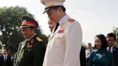 epa05432886 Vietnam's General Do Ba Ty, National Assembly Vice Chairman (L) and To Lam, Minister of Public Security (C) leave after attending a wreath laying ceremony at Martyrs Memorial ahead of the opening of the first session of the 14th National Assembly in Hanoi, Vietnam, 20 July 2016. The assembly runs from 20 to 29 July. EPA/LUONG THAI LINH
