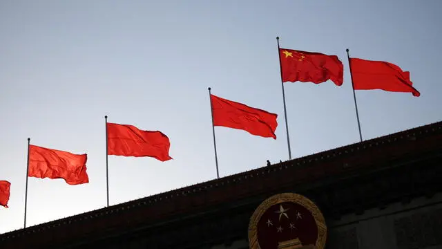 epa11195980 Chinese flags wave at the Great Hall of the People in Beijing, China, 03 March 2024. China holds two major annual political meetings, the National People's Congress (NPC), which will open on 05 March, and the Chinese People's Political Consultative Conference (CPPCC), which will open on 04 March, which run alongside and together are known as 'Lianghui' or 'Two Sessions.' EPA/ANDRES MARTINEZ CASARES