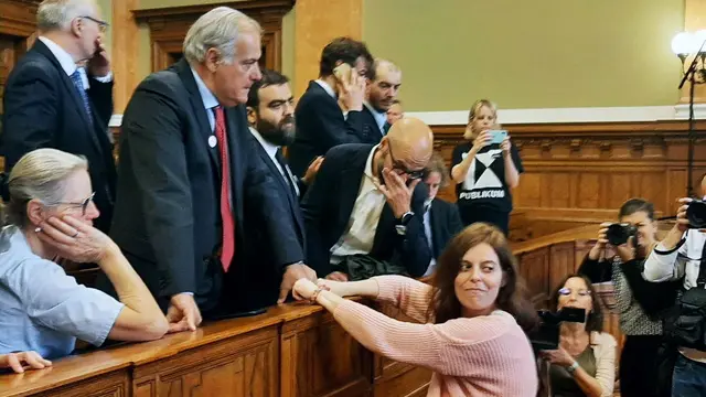 epa11365234 Italian defendant Ilaria Salis (R) greets her father (C-L) while attending her trial, in Budapest, Hungary, 24 May 2024. Salis, a 39-year-old teacher from Milan, has been held in a Hungarian prison since February 2023 on charges of having attacked three far-right supporters during a demonstration in Budapest. EPA/Enrico Martinelli BEST QUALITY AVAILABLE