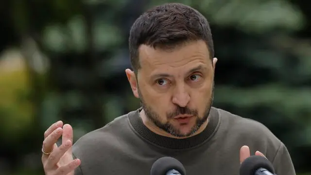 epa11331164 Ukrainian President Volodymyr Zelensky speaks during a joint press conference with Slovak President Zuzana Caputova (not pictured) in Kyiv, Ukraine, 10 May 2024. Zuzana Caputova arrived in Kyiv to meet with top Ukrainian officials amid the ongoing Russian invasion. EPA/SERGEY DOLZHENKO
