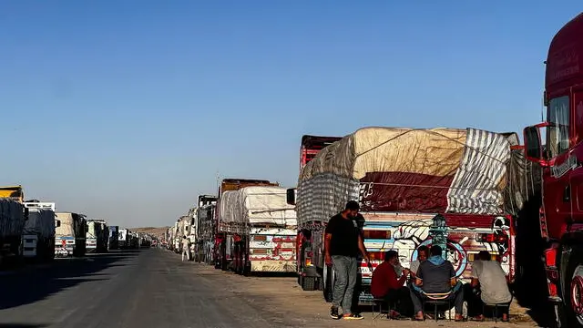 epa11325259 Trucks carrying humanitarian aid to Gaza line up waiting to move towards Rafah border crossing, from Arish, Egypt, 07 May 2024, after Israel took control of the Gazan side of the Rafah crossing. The Israel Defence Forces (IDF) said on 07 May that its ground troops began an operation targeting Hamas militants and infrastructure within specific areas of eastern Rafah, taking operational control of the Gazan side of the Rafah crossing based on intelligence information. More than 34,600 Palestinians and over 1,455 Israelis have been killed, according to the Palestinian Health Ministry and the IDF, since Hamas militants launched an attack against Israel from the Gaza Strip on 07 October 2023, and the Israeli operations in Gaza and the West Bank which followed it. EPA/STR