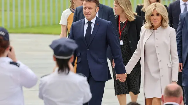 epa11371371 French President Emmanuel Macron (L) and his wife Brigitte Macron attend the Democracy festival, as part of the '75 years of the Basic Law' celebrations in Berlin, Germany, 26 May 2024. Macron visit Germany from 26 to 28 May. The French President and Federal President Steinmeier will visit several regions of Germany together. It is the first state visit - the highest form of visit in diplomatic protocol - by a French president to Germany in 24 years. EPA/HANNIBAL HANSCHKE