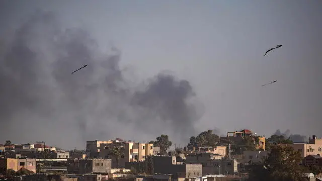 epa11367086 Smoke rises after an Israeli airstrike in Rafah, southern Gaza Strip, 24 May 2024. The International Court of Justice (ICJ) on 24 May ordered Israel to halt its military operation in Rafah, to open the Rafah border crossing with Egypt to allow for the entry of humanitarian aid, to allow access to Gaza for investigators, and to report to the court within one month on its progress. More than 35,000 Palestinians and over 1,400 Israelis have been killed, according to the Palestinian Health Ministry and the Israel Defense Forces (IDF), since Hamas militants launched an attack against Israel from the Gaza Strip on 07 October 2023, and the Israeli operations in Gaza and the West Bank which followed it. EPA/HAITHAM IMAD