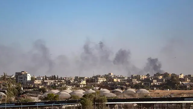 epa11367087 Smoke rises after an Israeli airstrike in Rafah, southern Gaza Strip, 24 May 2024. The International Court of Justice (ICJ) on 24 May ordered Israel to halt its military operation in Rafah, to open the Rafah border crossing with Egypt to allow for the entry of humanitarian aid, to allow access to Gaza for investigators, and to report to the court within one month on its progress. More than 35,000 Palestinians and over 1,400 Israelis have been killed, according to the Palestinian Health Ministry and the Israel Defense Forces (IDF), since Hamas militants launched an attack against Israel from the Gaza Strip on 07 October 2023, and the Israeli operations in Gaza and the West Bank which followed it. EPA/HAITHAM IMAD