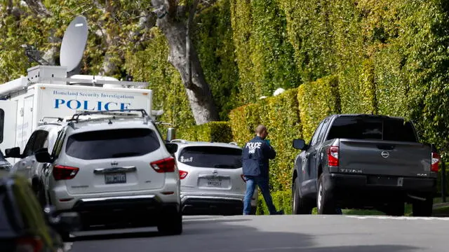 epa11243752 A federal investigator stands on a closed off road outside of a home owned by rapper and record producer Sean 'Diddy' Combs in Los Angeles, California, USA, 25 March 2024. The United States' Department of Homeland Security confirmed that the raid on Combs home was part of an ongoing investigation. EPA/CAROLINE BREHMAN