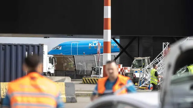 epa11378220 Emergency services attend at the airport where a person died after falling into running aircraft engine, at Schiphol, Netherlands, 29 May 2024. The Marechaussee, the branch of the military responsible for policing the airport, is investigating the incident. EPA/Michel van Bergen