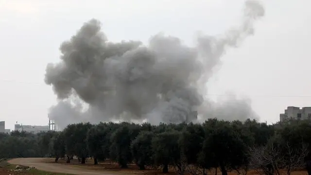 epa08192583 Smoke rises during government forces bombing on the village of Sarman, in Maarrat al-Nu'man district, Idlib, Syria, 04 February 2020. According to Syrian official news reports, the Syrian army units launched operation against last rebel-held stronghold in Idleb and the surrounding areas. According to the UN, 520,000 people were displaced since the operations began in December 2019. EPA/YAHYA NEMAH