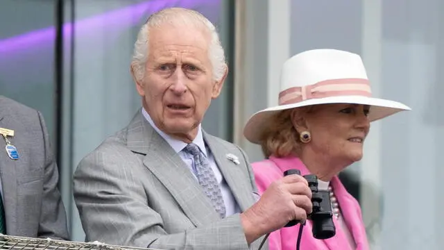 epa11382209 Britain's King Charles III watches his horse Treasure racing during Ladies Day at the Epsom Derby in Epsom Downs in Surrey, Britain, 31 May 2024. The Epsom Derby Festival of horse racing, which dates back to 1780, takes place on 31 May and 01 June 2024. EPA/TOLGA AKMEN