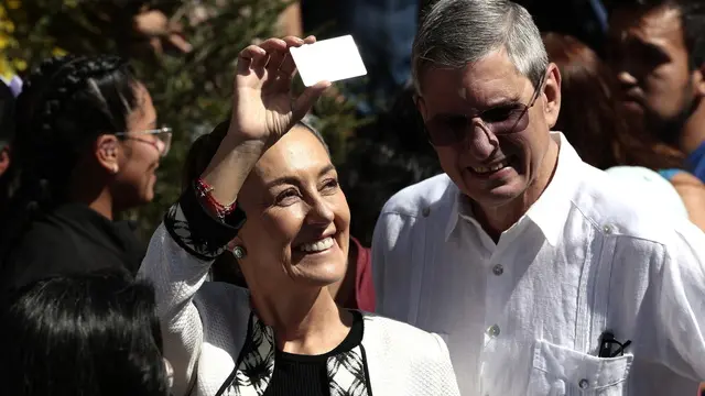 epa11385979 Mexican presidential candidate Claudia Sheinbaum waits in line to vote in the Mexican general elections at a polling station in Mexico City, Mexico, 02 June 2024. Mexican people are called to elect more than 20.000 positions around the country, including the president, vice president, and 500 deputies. EPA/JOSE MENDEZ