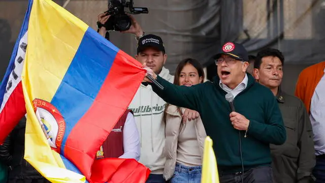 epa11313289 Colombia's President Gustavo Petro waves a Colombian national flag in the middle of his speech at the end of a demonstration to mark International Workers' Day on Wednesday at Bolivar square in Bogota, Colombia, 01 May 2024. Petro announced in a speech to workers that he will break relations with Israel on 02 May over what he called "genocide" against the Palestinian people. 'Here in front of you, the government of change, the president of the Republic, informs that tomorrow diplomatic relations with the State of Israel will be broken â€¦ for having a government, for having a genocidal president,' Petro said at the event in Bogota. EPA/Mauricio Duenas Castaneda