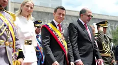 epa11367262 Ecuadorian President Daniel Noboa (C), accompanied by his wife, Lavinia Valbonesi (2-L) and the National Assembly President Henry Kronfle (2-R), leaves after presenting his first report to the nation, in Quito, Ecuador, 24 May 2024. In his speech before the National Assembly, after having served six months in office, Noboa admitted that his government had to make 'hard and profound decisions that no one had risked taking before but that were necessary to guide the country towards a new Ecuador.' EPA/JOSE JACOME