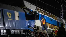 epaselect epa08546514 Firefighters work in the aftermath of a train crash near the city of Cesky Brod, Czech Republic, 15 July 2020. According to media reports, at least one person died and 35 people were injured after a cargo and a passenger train collided between Uvaly and Cesky Brod. EPA/MARTIN DIVISEK